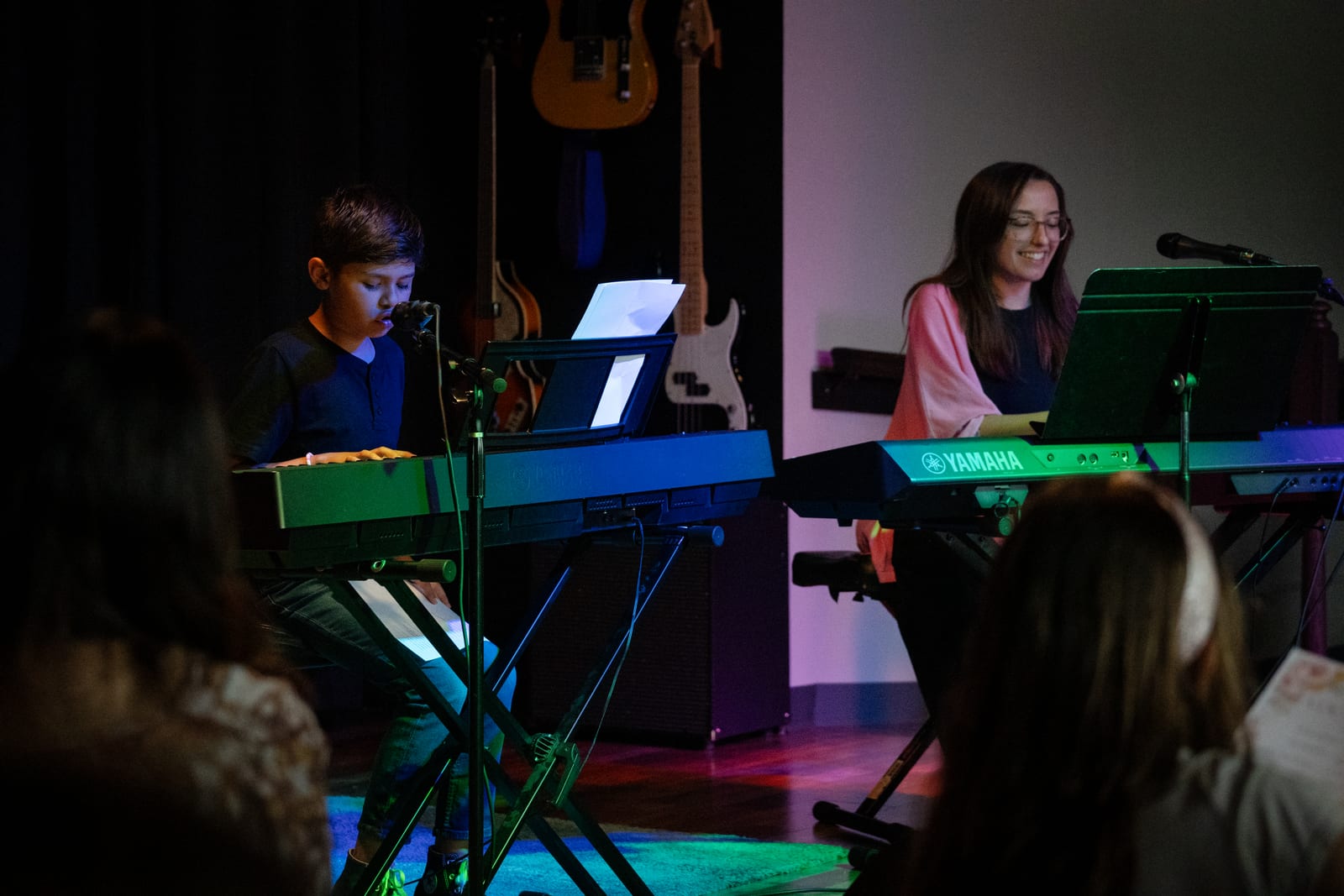 Vocal student performing on the Twelve Tone stage during the Fall Vocal Showcase in Glenview, IL